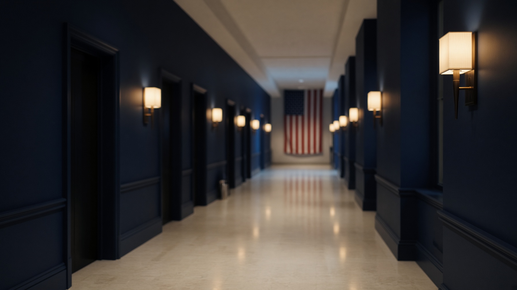 Quiet hospital corridor with an American flag at the far end